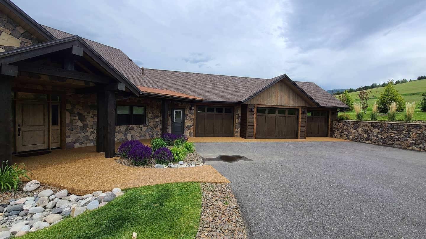 Resin-bound pea gravel epoxy entry apron and walkway in caramel tone at a residential home