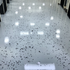 Office hallway floor covered with a beautiful gray base epoxy floor coat  and 30% broadcasted epoxy flake. 