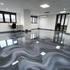 Office floor covered with a beautiful multiple shade of gray, charcoal and white marble epoxy floor coat. 